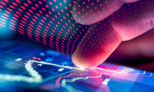 Trader analyzing financial performance data on screen