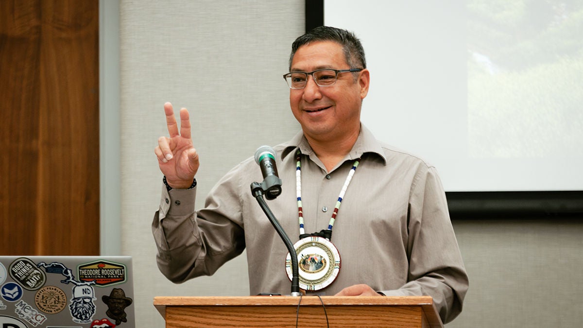 Speaker interacting with the attendees at the tribal community funding meeting