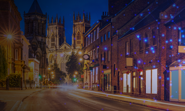 Light trails on the road to York Minster gothic style Church of England cathedral in city of York