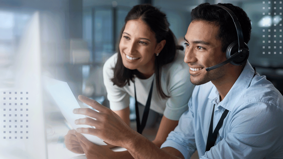 shot of a young man and woman using a computer while working in a call centre
