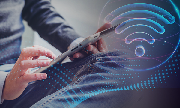 Business person using on tablet with wifi sign network connection